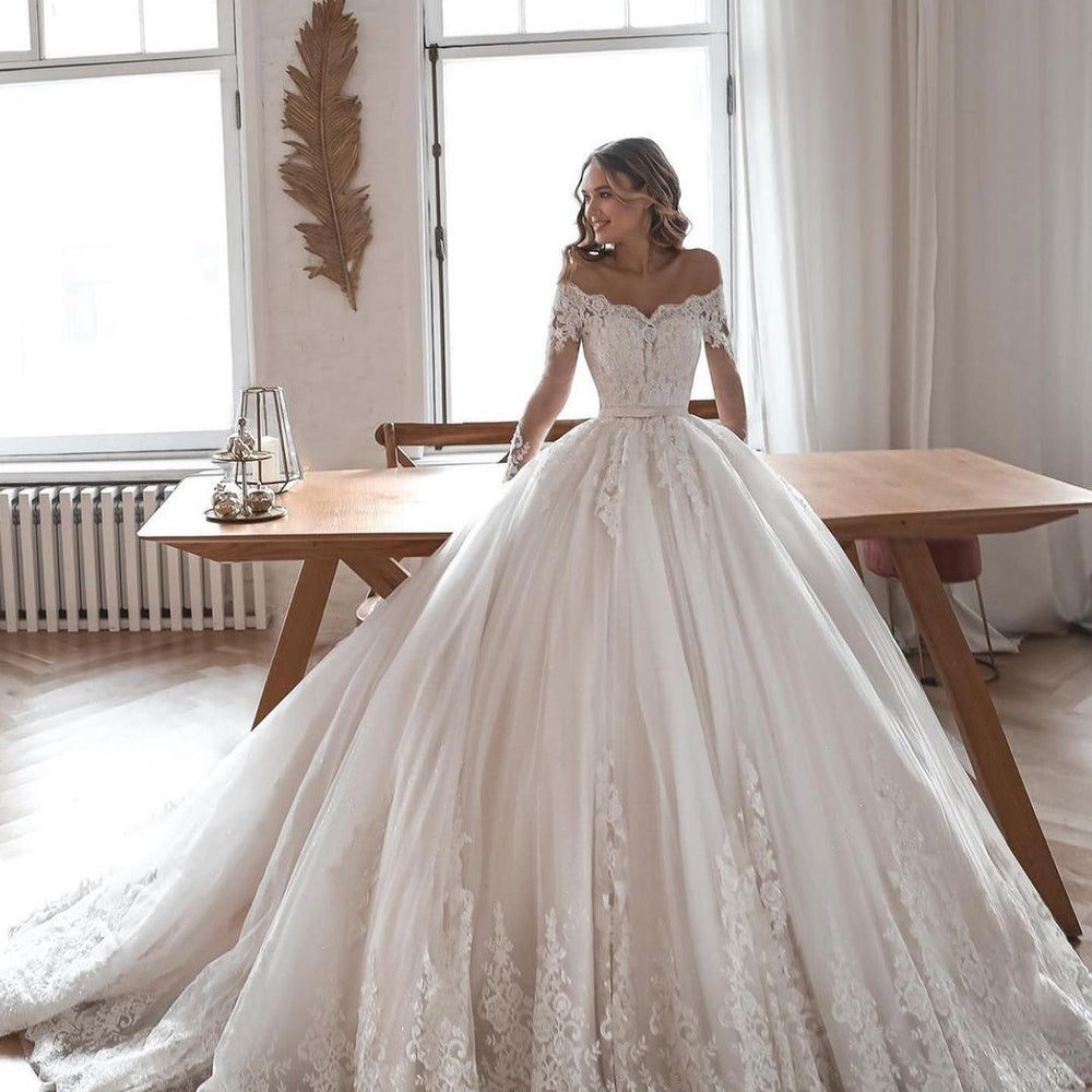 
                      
                        Long Ball Gown Wedding Dress with Sleeves, Lace, and Tulle
                      
                    