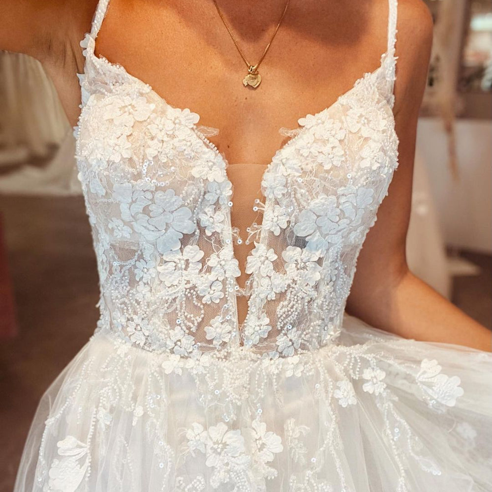 
                      
                        Long A-Line Deep V-Neck Spaghetti Strap Backless Wedding Dress with Lace Tulle
                      
                    