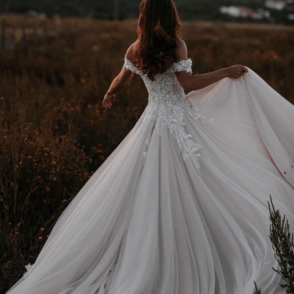 
                      
                        A-Line Off-the-Shoulder Tulle Wedding Dress with Lace Appliques
                      
                    