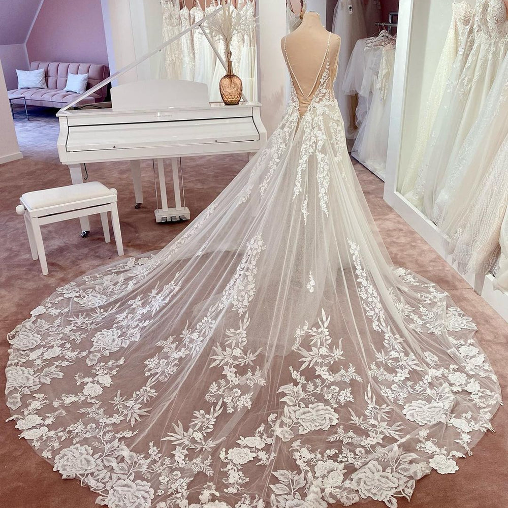 
                      
                        Long A-Line V-Neck Sleeveless Floral Lace Wedding Dress with Tulle and Boho Style
                      
                    