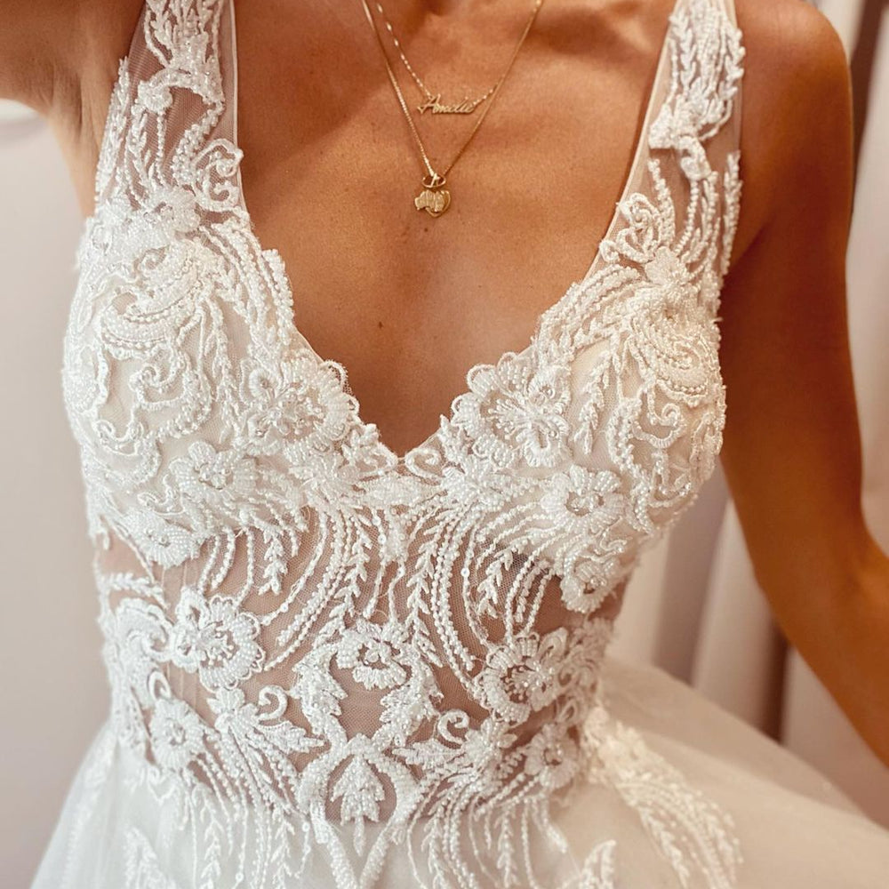 
                      
                        Elegant A-Line Deep V-Neck Backless Wedding Dress with Lace Appliques
                      
                    