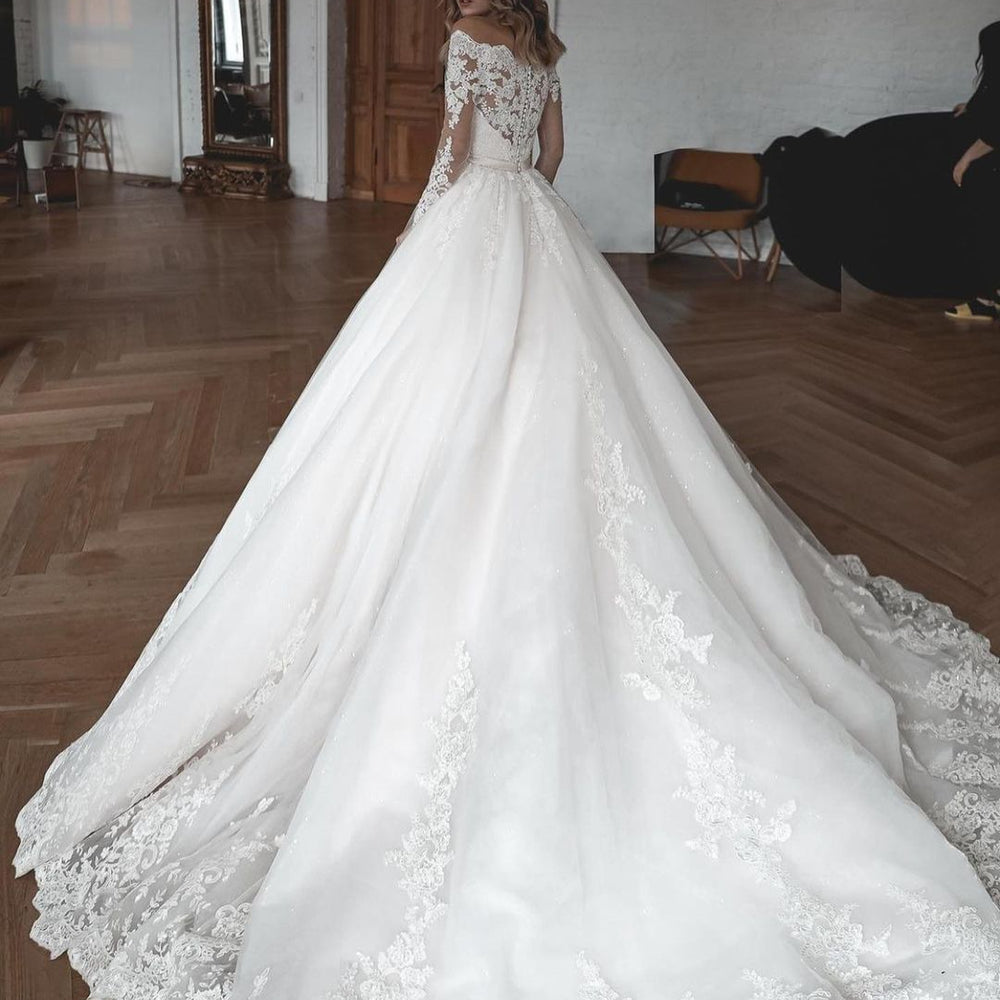 
                      
                        Long Ball Gown Wedding Dress with Sleeves, Lace, and Tulle
                      
                    