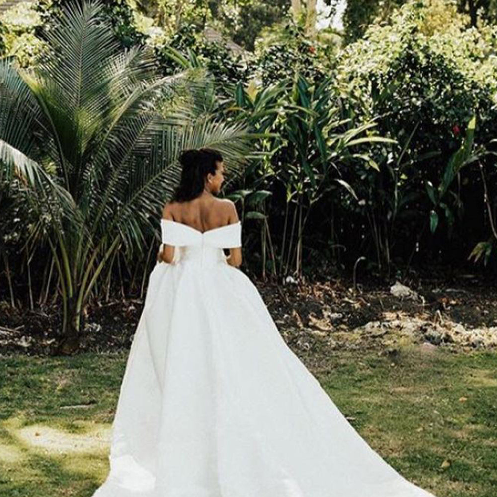 
                      
                        White V-Neck Off-the-Shoulder Ball Gown Wedding Dress with Lace
                      
                    