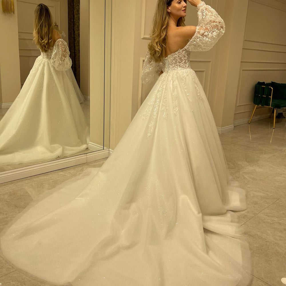 
                      
                        Sweetheart Long Sleeve Backless A-Line Train Wedding Dress with Lace Appliques
                      
                    