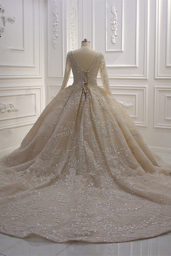 
                      
                        Long Sleeve V-Neck Ball Gown Wedding Dress with Sequins, Beading, and Ruffles
                      
                    