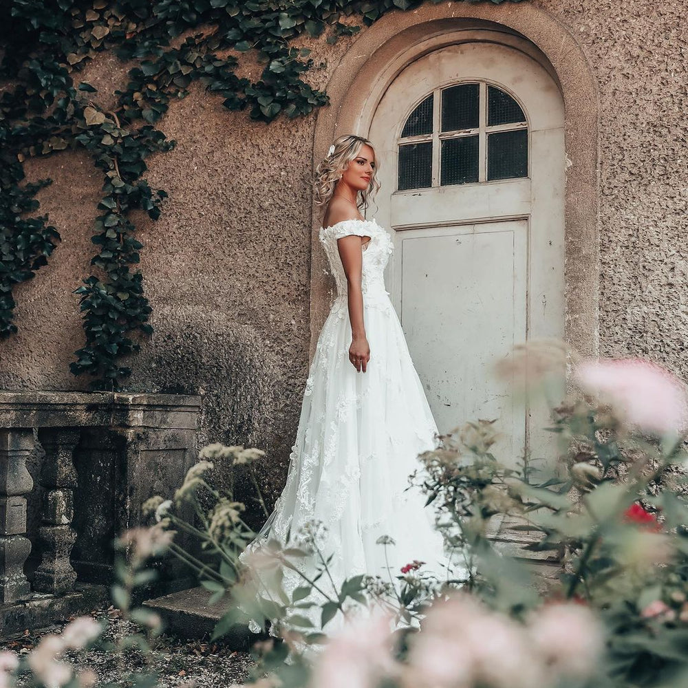 
                      
                        Long A-Line Off-the-Shoulder Wedding Dress with 3D Floral Lace Appliques
                      
                    