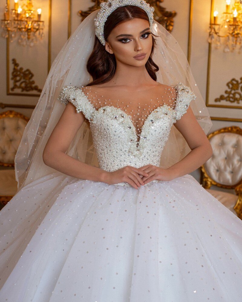 
                      
                        Glamorous Off-the-Shoulder Beaded Princess Wedding Dress with Pearl and Tulle
                      
                    