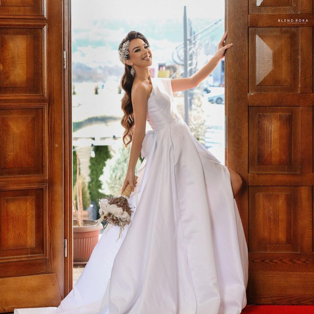 
                      
                        Long Sleeveless A-Line One-Shoulder Satin Wedding Dress with Slit
                      
                    