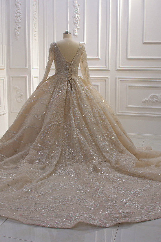 
                      
                        Long Sleeve V-Neck Ball Gown Wedding Dress with Sequins, Beading, and Ruffles
                      
                    