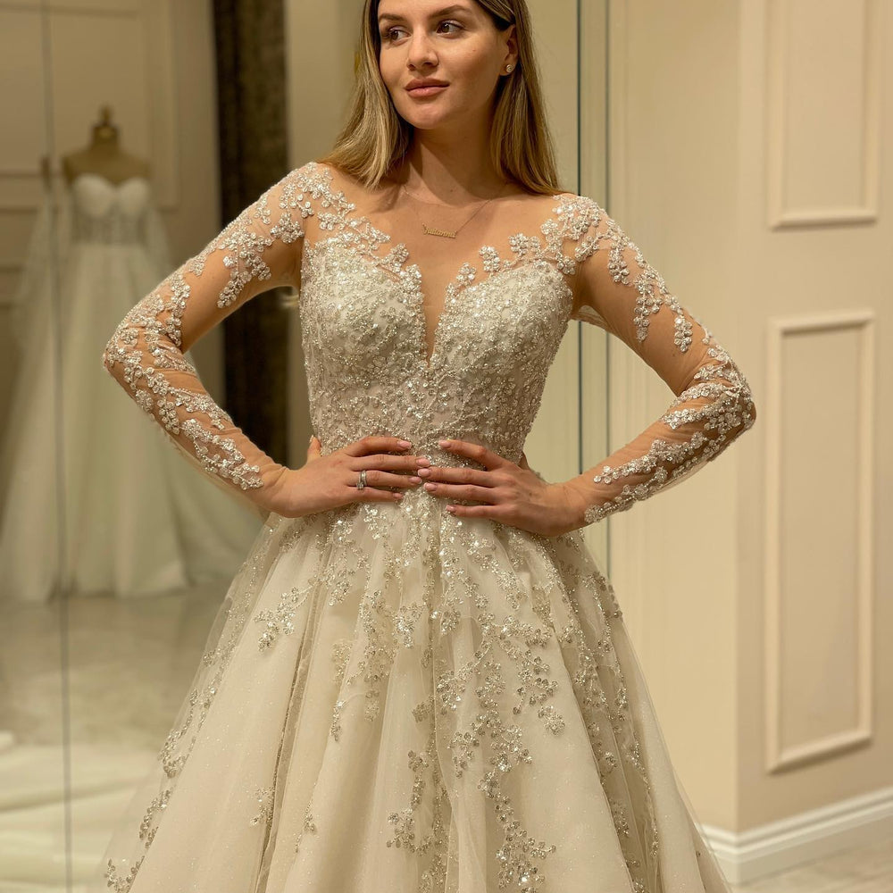 
                      
                        Elegant Long A-Line Wedding Dress with Lace Appliques and Sleeves
                      
                    