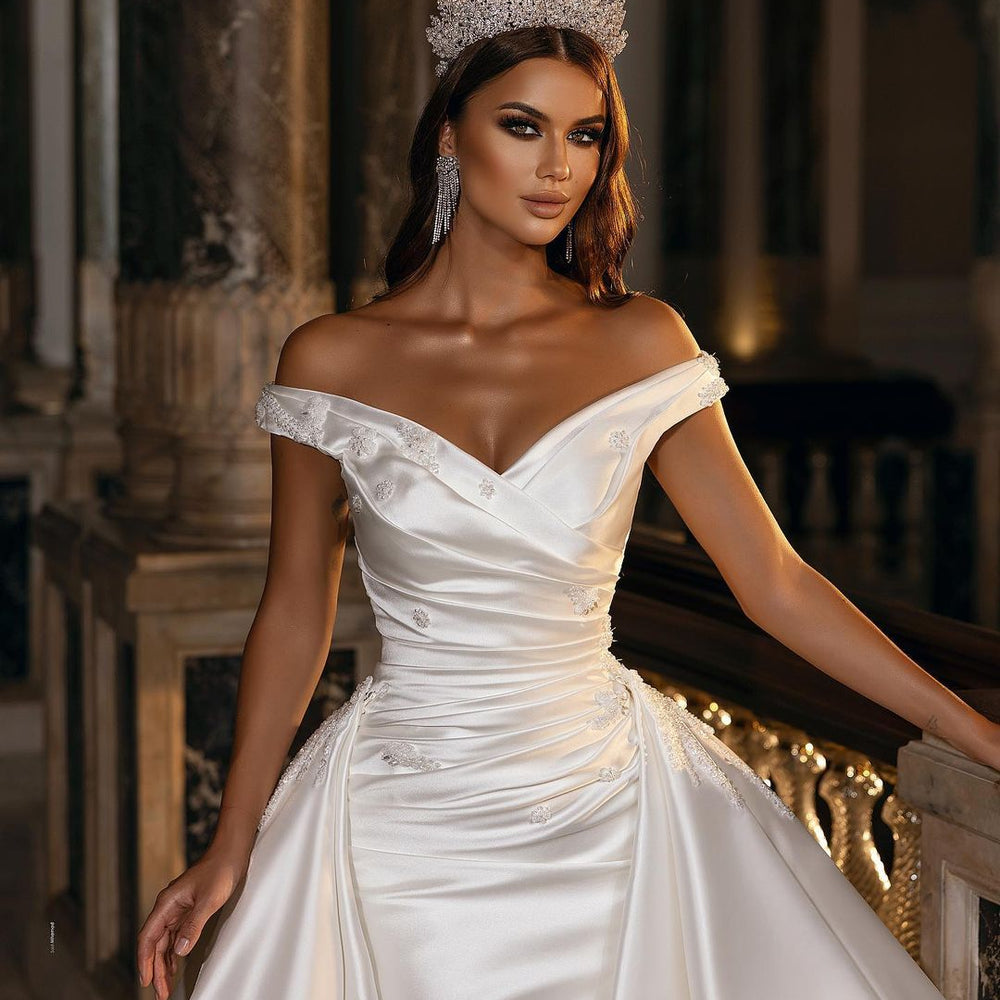 
                      
                        A-Line Off-the-Shoulder Sweetheart Backless Satin Wedding Dress with Ruffles and Appliques
                      
                    