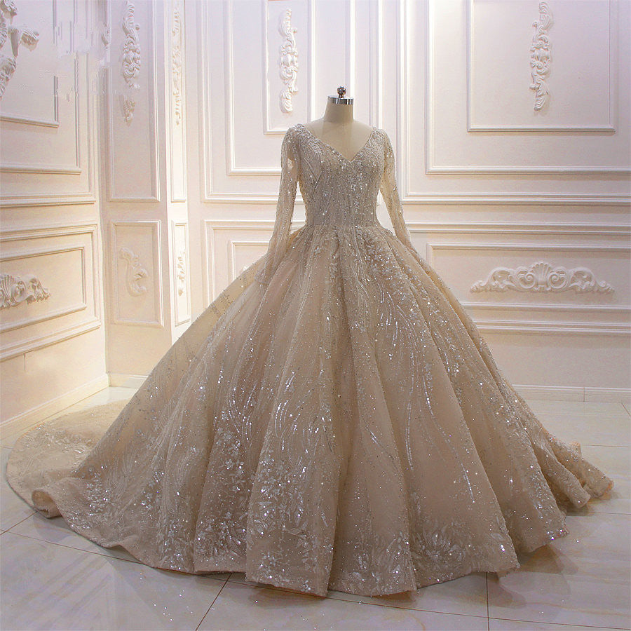 
                      
                        Long Sleeve V-Neck Ball Gown Wedding Dress with Sequins, Beading, and Ruffles
                      
                    