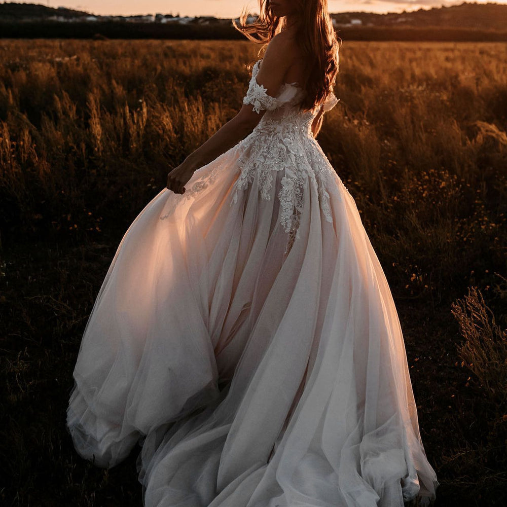 
                      
                        Off-the-Shoulder Tulle Train A-Line Wedding Dress with Lace Appliques
                      
                    