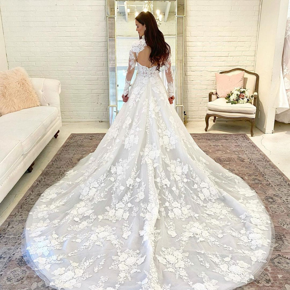 
                      
                        Long A-Line High Neck Open Back Wedding Dress with Lace Sleeves
                      
                    