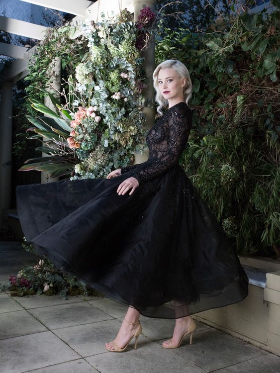 
                      
                        Black Bateau Long Sleeve Tea-Length Wedding Dress with Lace Appliques
                      
                    