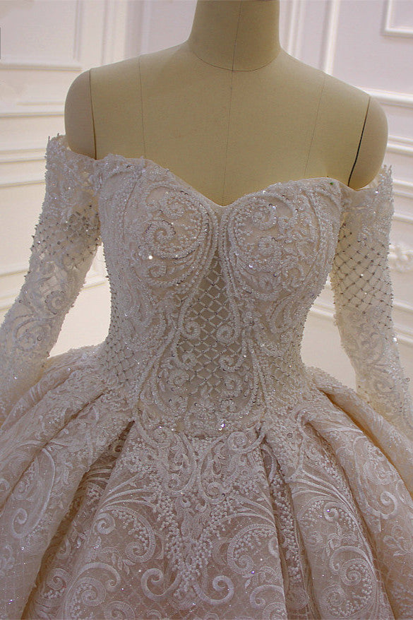 
                      
                        Off-the-Shoulder Long Sleeve Ball Gown Wedding Dress with Lace Appliques
                      
                    