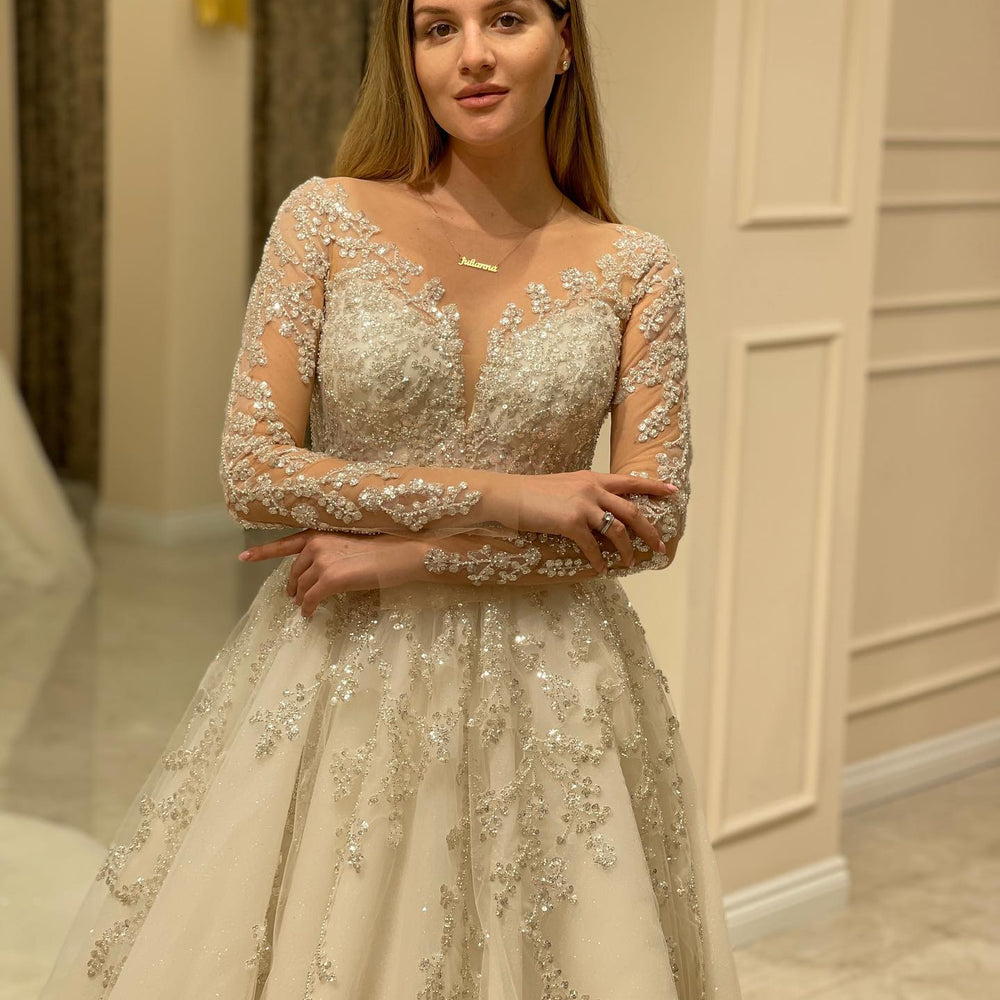 
                      
                        Elegant Long A-Line Wedding Dress with Lace Appliques and Sleeves
                      
                    