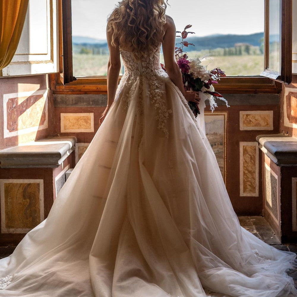 
                      
                        Sweetheart Backless Train A-Line Wedding Dress with Tulle and Floral Lace
                      
                    