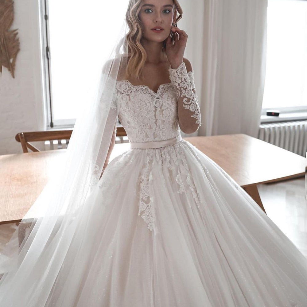 
                      
                        Long Ball Gown Wedding Dress with Sleeves, Lace, and Tulle
                      
                    