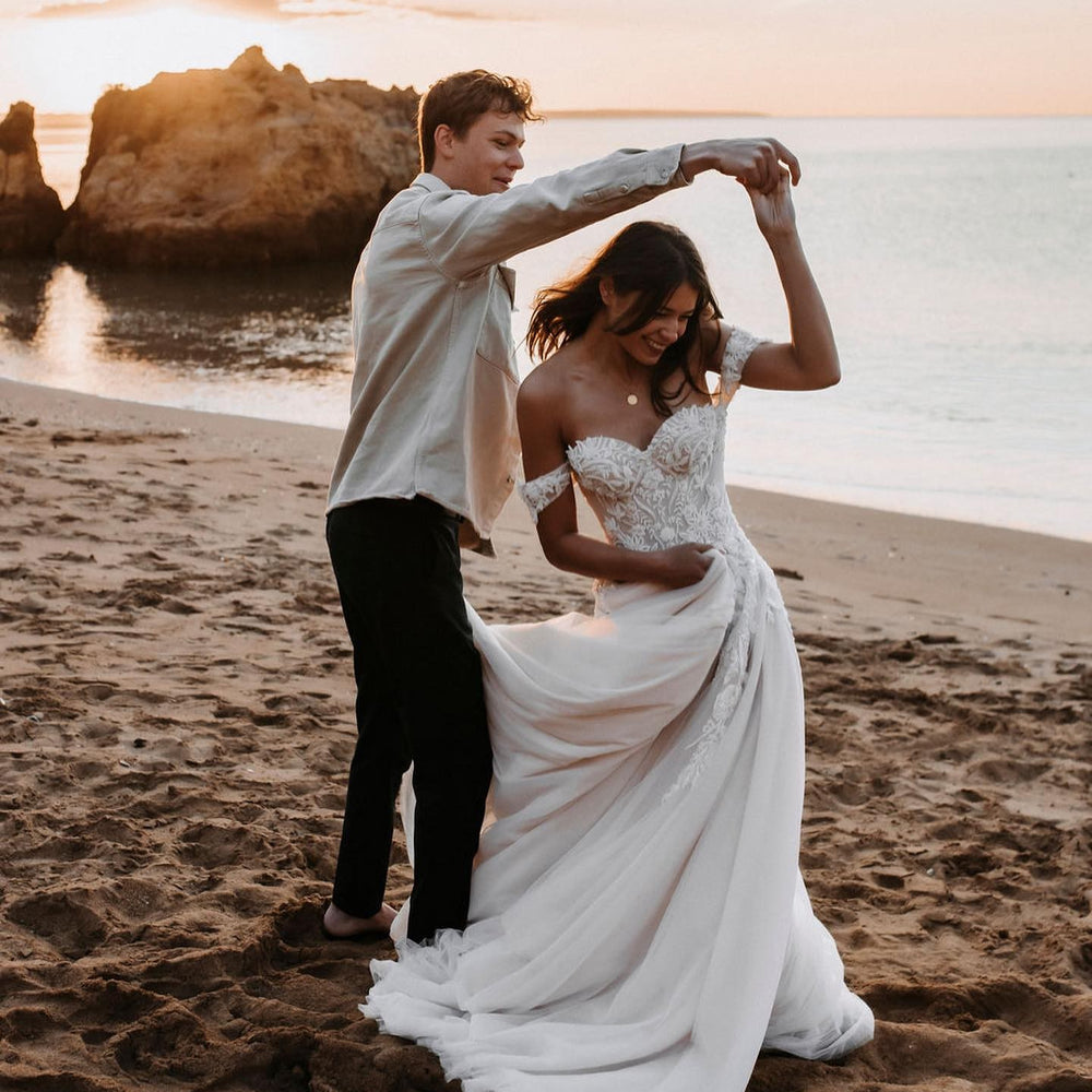 
                      
                        Off-the-Shoulder Tulle Train A-Line Wedding Dress with Lace Appliques
                      
                    