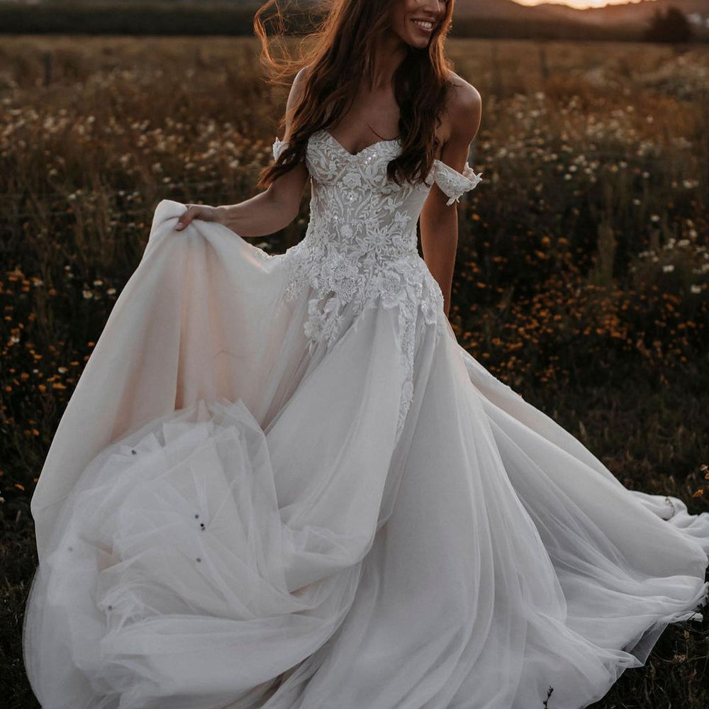 
                      
                        A-Line Off-the-Shoulder Tulle Wedding Dress with Lace Appliques
                      
                    