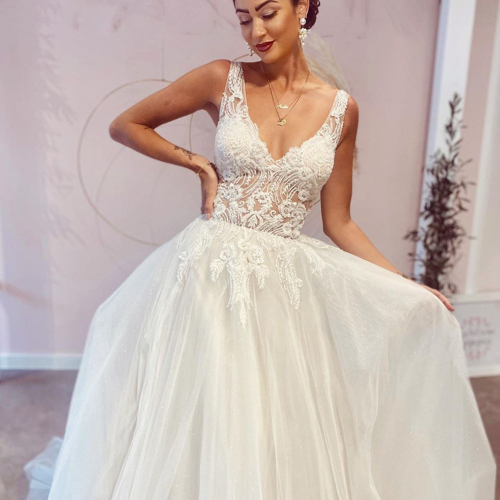 
                      
                        Elegant A-Line Deep V-Neck Backless Wedding Dress with Lace Appliques
                      
                    