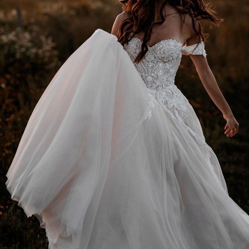 
                      
                        A-Line Off-the-Shoulder Tulle Wedding Dress with Lace Appliques
                      
                    