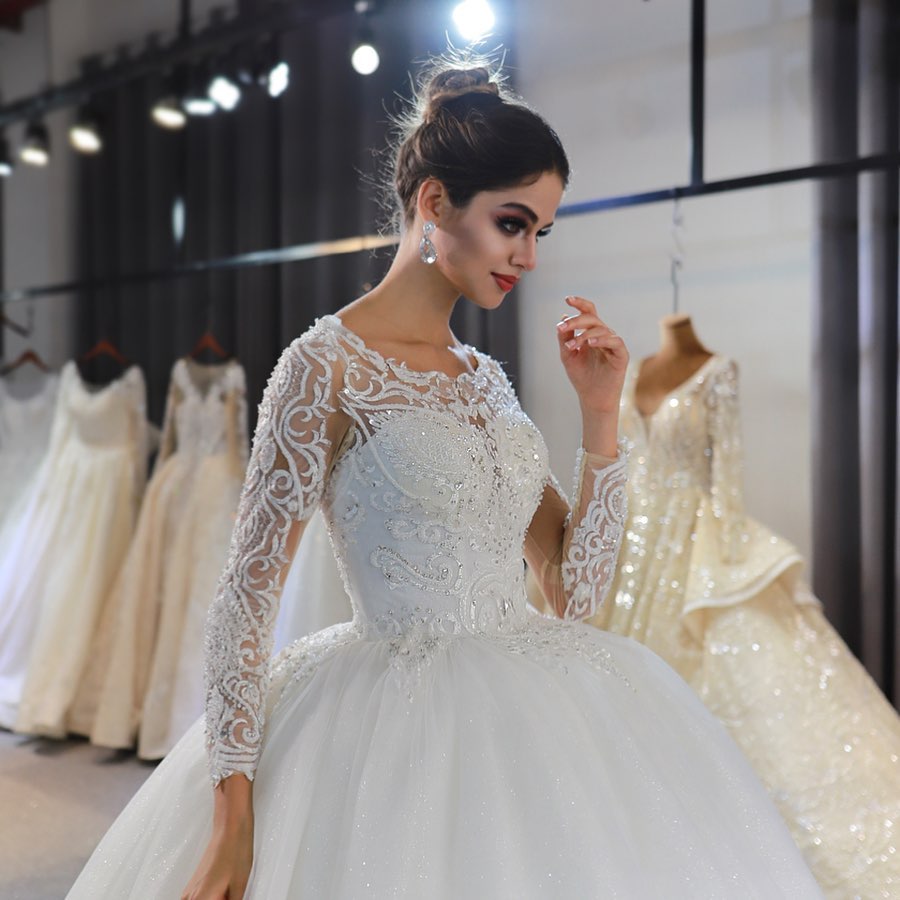 
                      
                        Gorgeous A-Line Bateau Long Sleeve Floor-Length Wedding Dress with Lace and Sequin Appliques
                      
                    