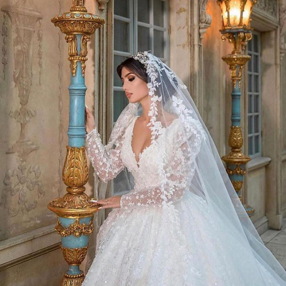 
                      
                        A-Line Deep V-Neck Long Sleeve Train Wedding Dress with Lace Appliques
                      
                    