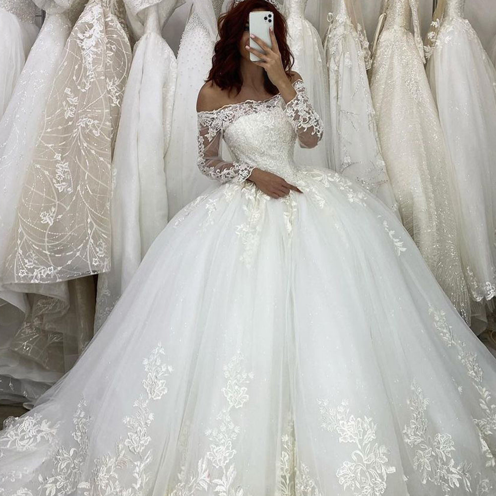 
                      
                        Off-the-Shoulder Long Sleeve Illusion Ball Gown Wedding Dress with Appliques
                      
                    