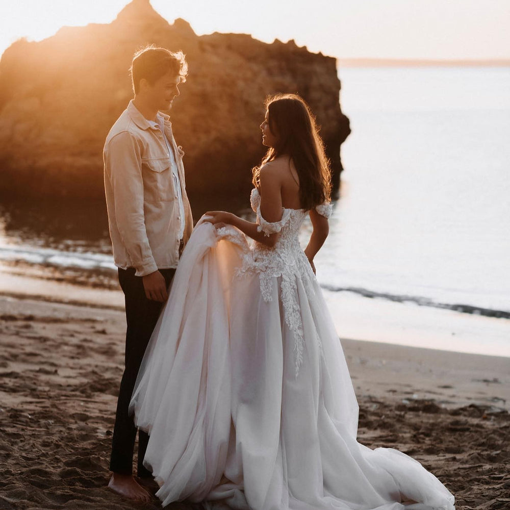 
                      
                        Off-the-Shoulder Tulle Train A-Line Wedding Dress with Lace Appliques
                      
                    