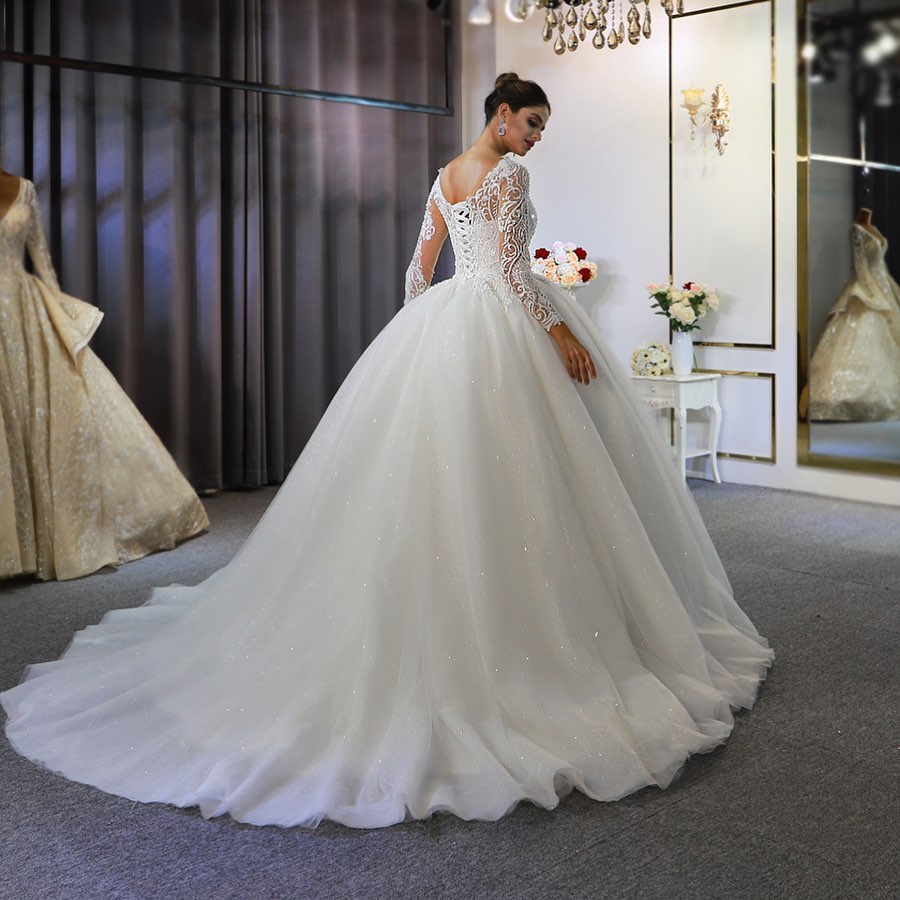 
                      
                        Gorgeous A-Line Bateau Long Sleeve Floor-Length Wedding Dress with Lace and Sequin Appliques
                      
                    