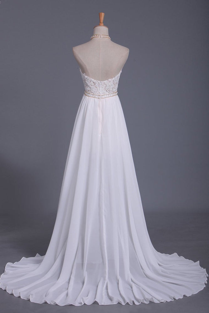 
                      
                        Halter Backless Chiffon A-Line Wedding Dress with Ruffles and Pearl Lace
                      
                    