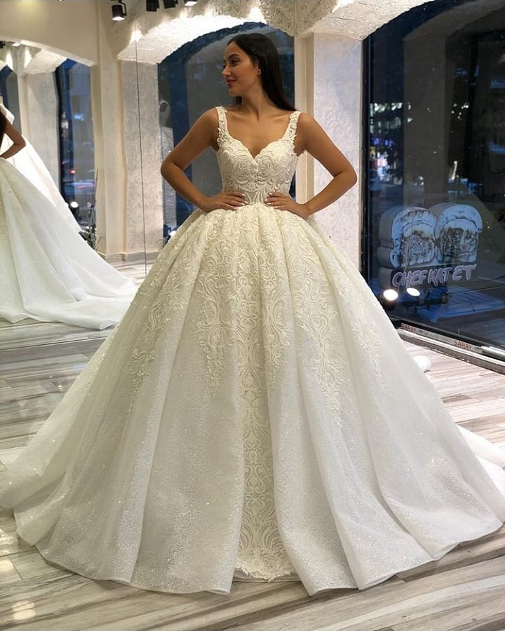 
                      
                        Sweetheart Spaghetti Strap Backless Ball Gown Wedding Dress with Lace Appliques and Sequins
                      
                    