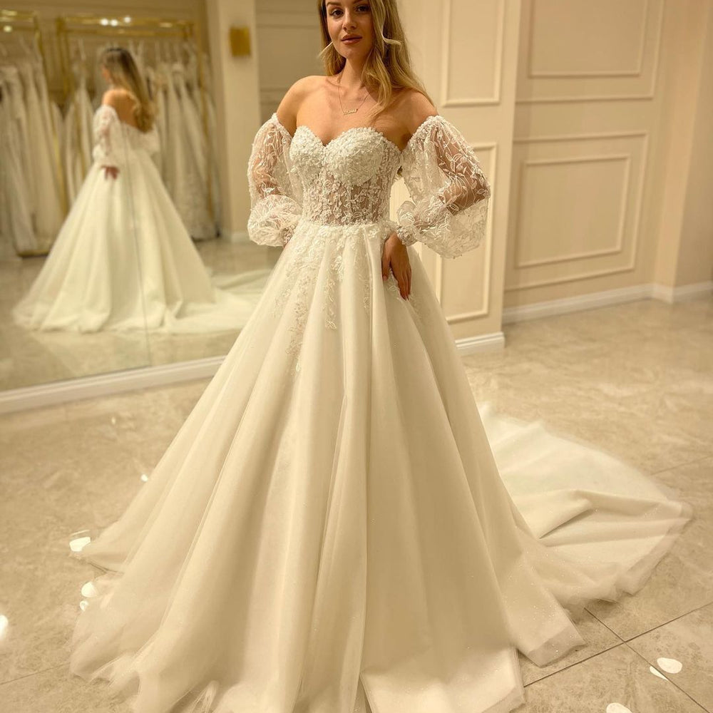 
                      
                        Sweetheart Long Sleeve Backless A-Line Train Wedding Dress with Lace Appliques
                      
                    