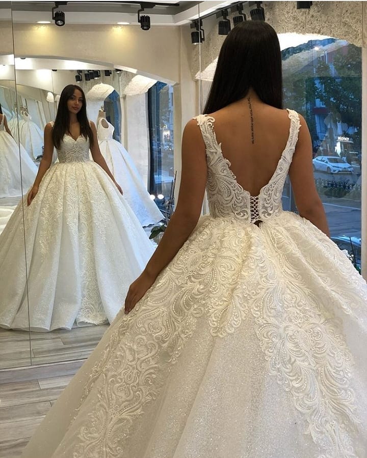 
                      
                        Sweetheart Spaghetti Strap Backless Ball Gown Wedding Dress with Lace Appliques and Sequins
                      
                    