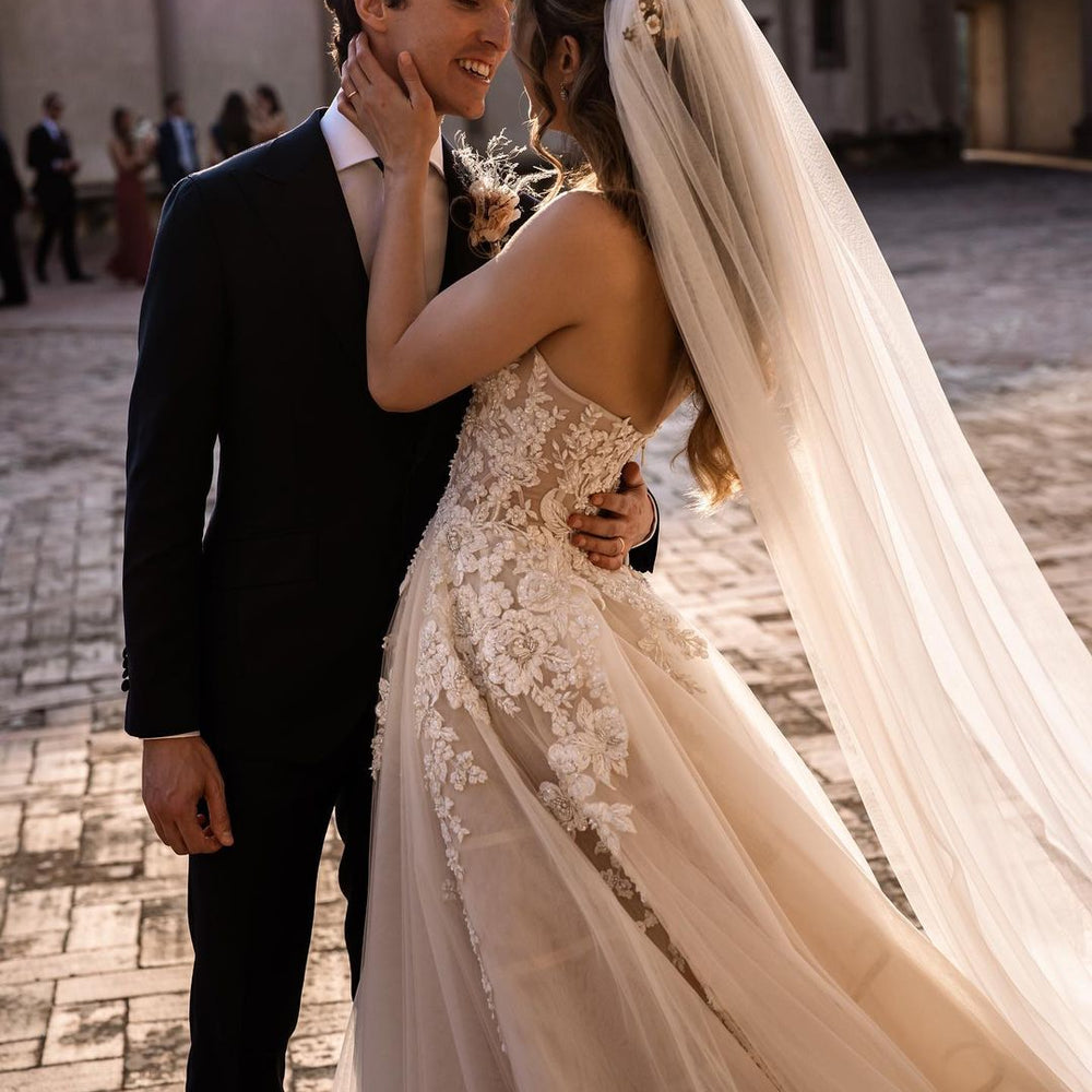 
                      
                        Sweetheart Backless Train A-Line Wedding Dress with Tulle and Floral Lace
                      
                    