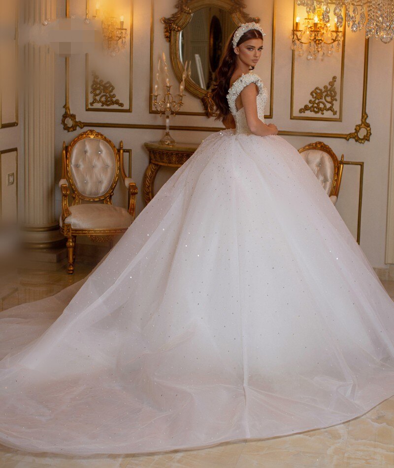 
                      
                        Glamorous Off-the-Shoulder Beaded Princess Wedding Dress with Pearl and Tulle
                      
                    