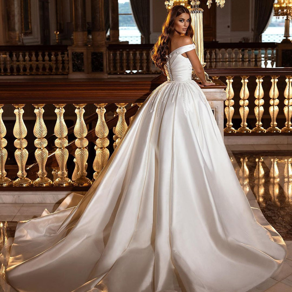 
                      
                        A-Line Off-the-Shoulder Sweetheart Backless Satin Wedding Dress with Ruffles and Appliques
                      
                    