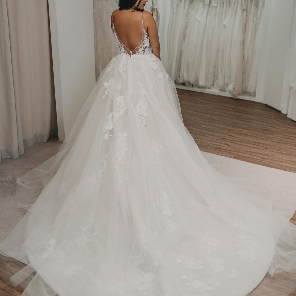 
                      
                        Elegant Long A-Line V-Neck Wedding Dress with Open Back and Tulle
                      
                    