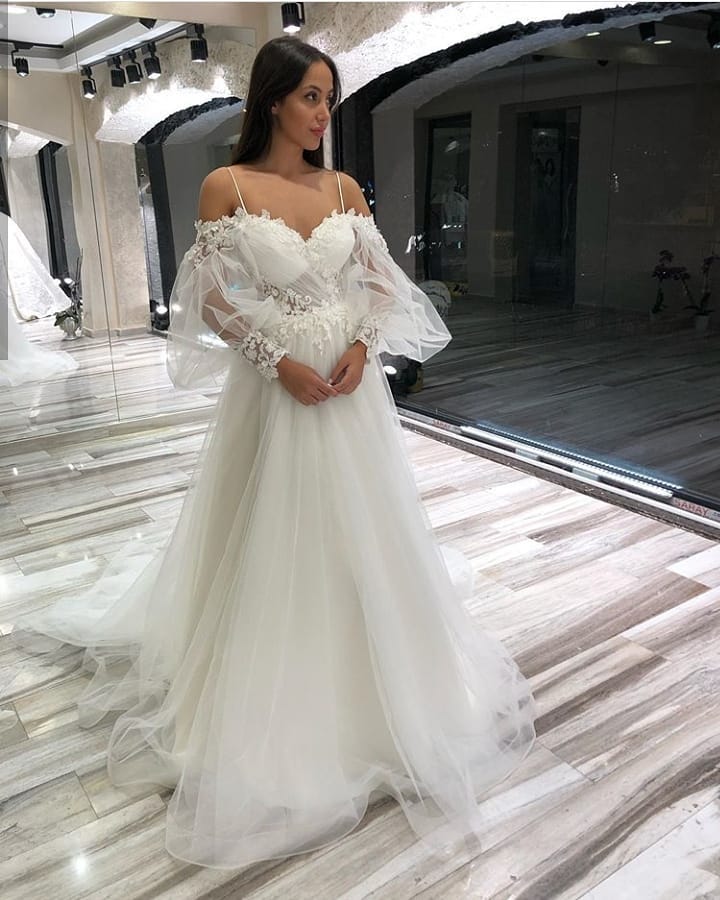 
                      
                        A-Line Off-the-Shoulder Long Sleeve Spaghetti Strap Wedding Dress with Lace Appliques and Tulle
                      
                    