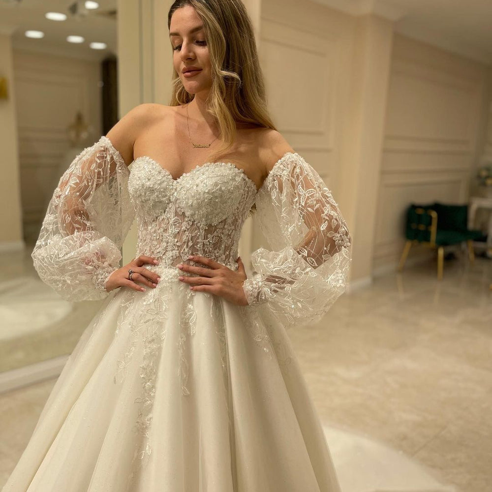 
                      
                        Sweetheart Long Sleeve Backless A-Line Train Wedding Dress with Lace Appliques
                      
                    