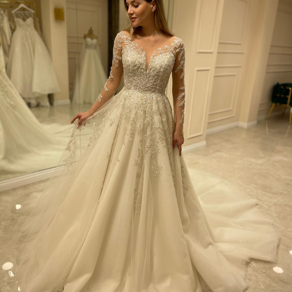 
                      
                        Elegant Long A-Line Wedding Dress with Lace Appliques and Sleeves
                      
                    