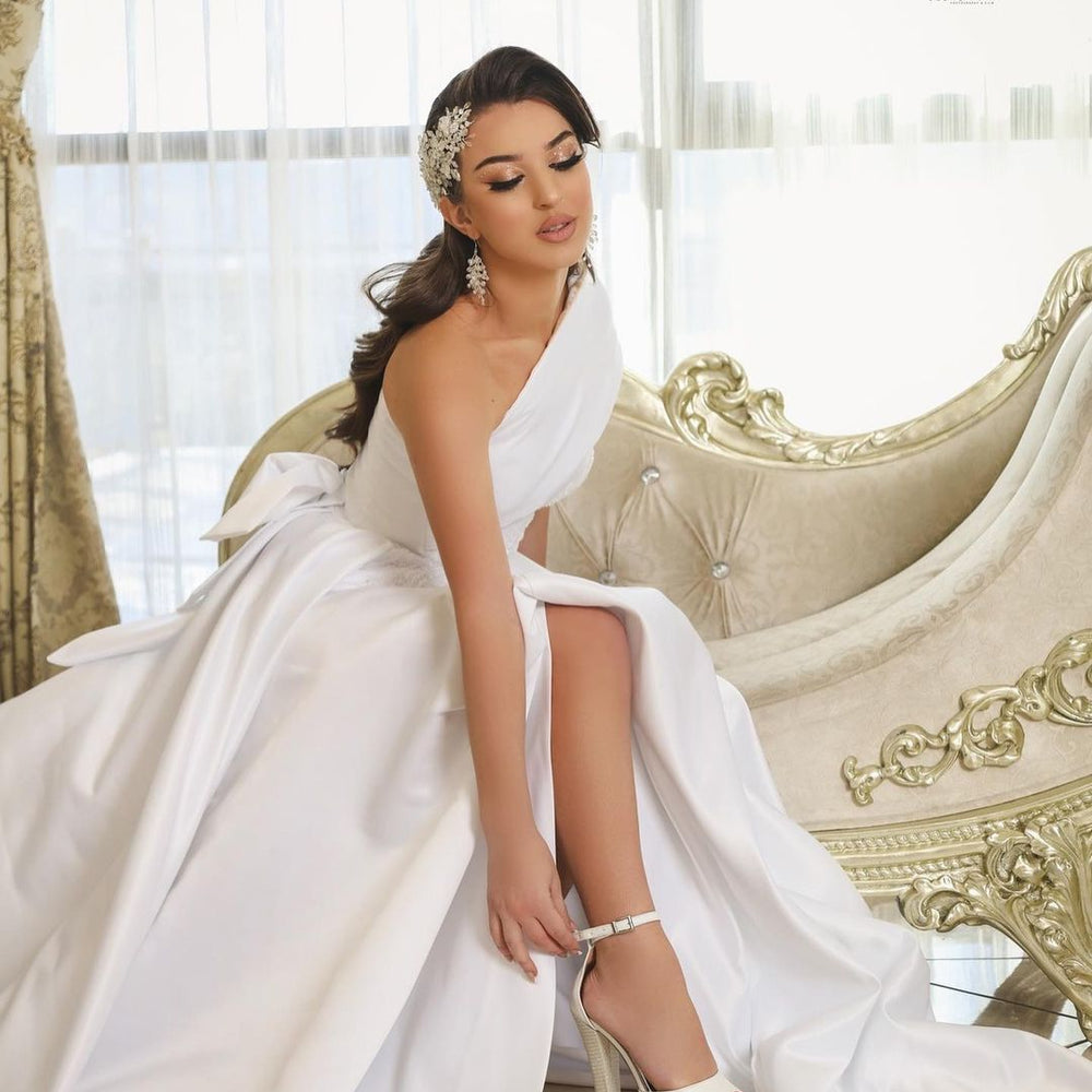 
                      
                        Long Sleeveless A-Line One-Shoulder Satin Wedding Dress with Slit
                      
                    