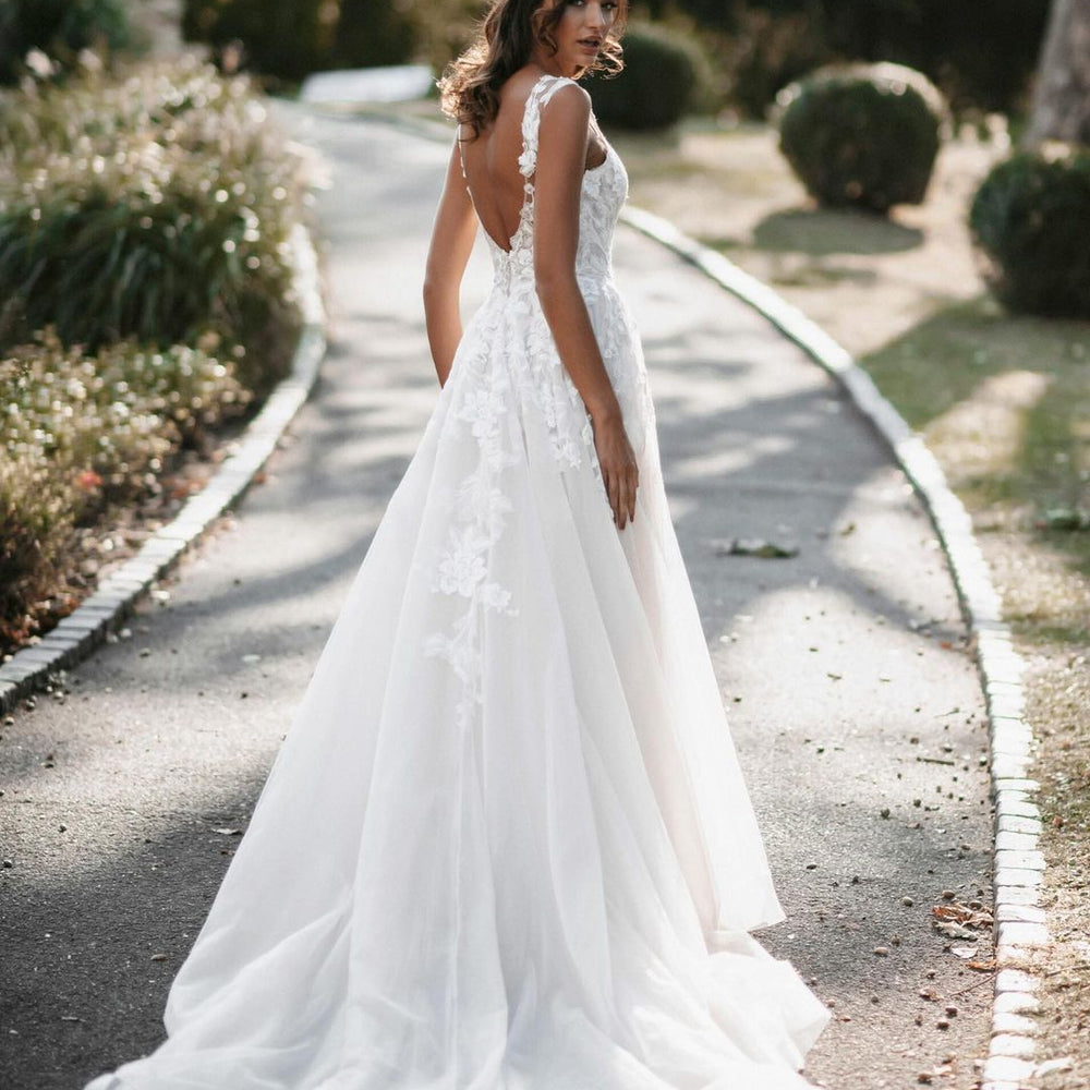 
                      
                        A-Line V-Neck Tulle Backless Long Wedding Dress with Lace
                      
                    