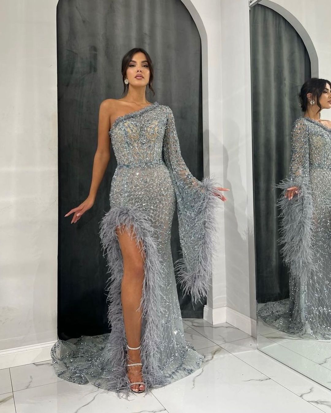 Opulent Feathered One-Shoulder Prom Gown with Intricate Beadwork