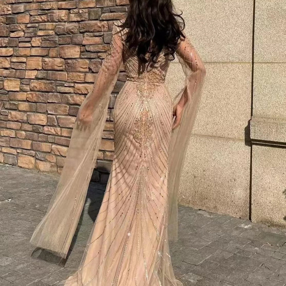 
                      
                        Stunning V-Neck Long Sleeve Tulle Mermaid Prom Gown Embellished with Beadwork
                      
                    