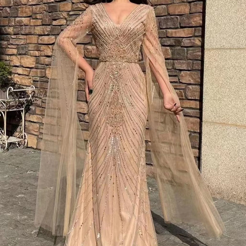 
                      
                        Stunning V-Neck Long Sleeve Tulle Mermaid Prom Gown Embellished with Beadwork
                      
                    